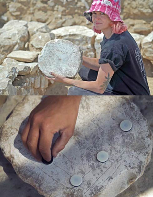 An excavation volunteer holding up an ancient game board found at the Rahat site. Soap production meant workers had idle time for games while they waited for the next stage in the manufacturing process. (Emil Aladjem/Israel Antiquities Authority)